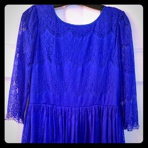 Vibrant blue lace dress with open back.